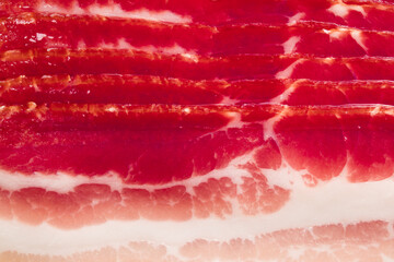 slices of sliced fatty bacon for background, close-up