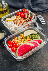 Meal prep containers with chicken, rice, avocado, tomato, corn, peas, watermelon radish, asparagus