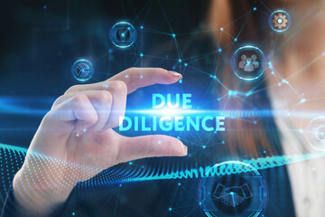 Business, Technology, Internet and network concept. Young businessman working on a virtual screen of the future and sees the inscription: Due diligence