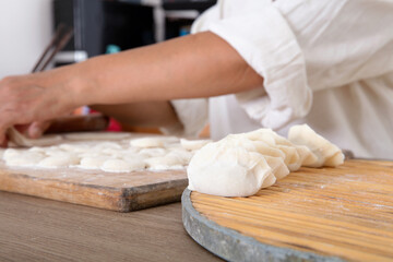 The making of food dumplings with Chinese festival symbols