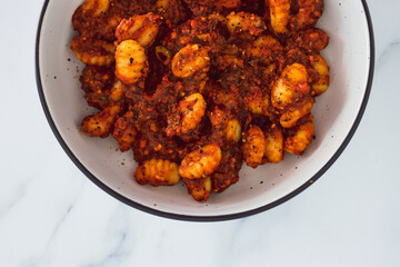 plant-based food,  vegan potato gnocchi with olive red pesto
