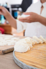 The making of food dumplings with Chinese festival symbols