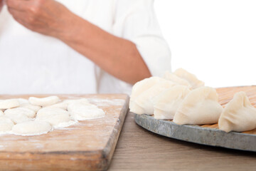 Fototapeta na wymiar The making of food dumplings with Chinese festival symbols