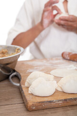 The Chinese make dumplings for traditional festivals in the kitchen