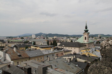 Fototapeta na wymiar top view of the city rooftops mountains on the horizon