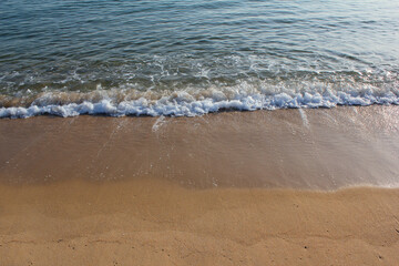 Soft beautiful ocean wave on sandy beach. Background