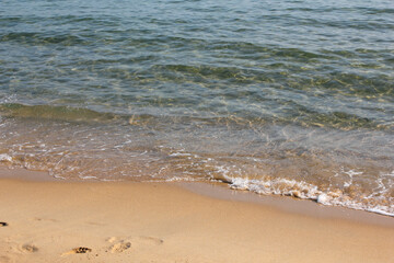 Soft beautiful ocean wave on sandy beach. Background