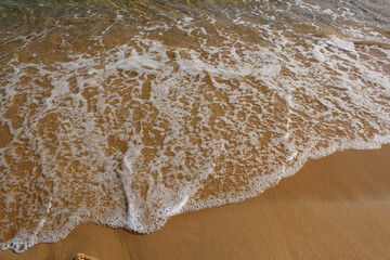 Sand beach and spume