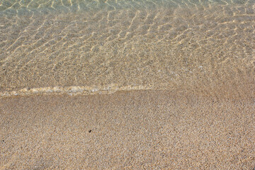 Soft beautiful ocean wave on sandy beach. Background