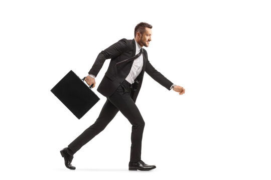 Full length profile shot of a businessman with a briefcase running
