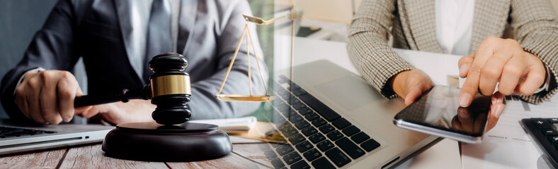 Business and lawyers discussing contract papers with brass scale on desk in office. Law, legal...