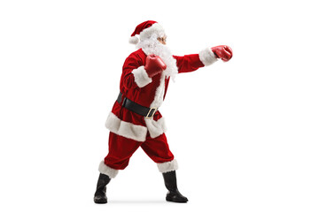 Full length profile shot of santa claus training box