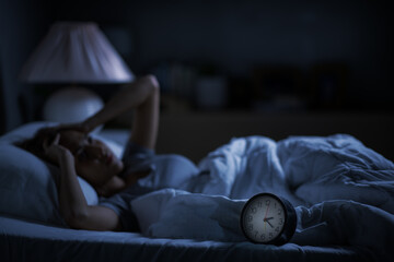 Depressed young woman lying in bed cannot sleep from insomnia - obrazy, fototapety, plakaty