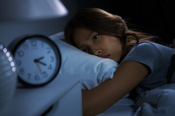 Depressed young woman lying in bed cannot sleep from insomnia - 397135028
