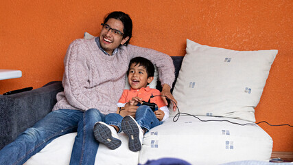 A man and small child playing video games