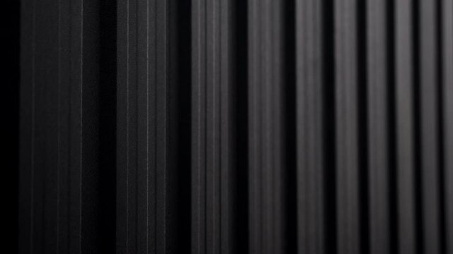 Black Corrugated metal sheet surface of the wall. Galvanize steel background.