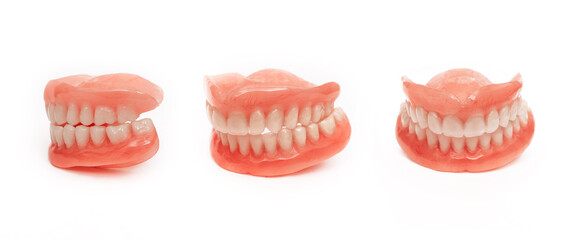 Full denture close-up. Dentures. Full removable plastic denture of the jaws. Isolate on white...