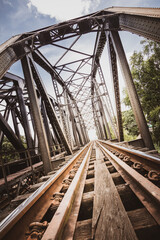 Old steel railway bridge over the pranburi river in thailand