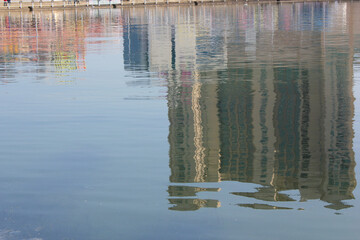 Reflection of buildings  in water, river, pond, sea