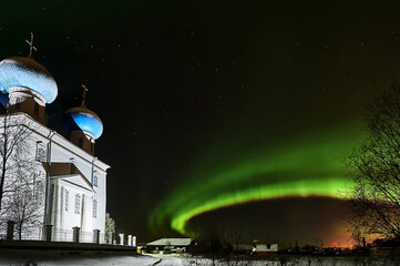 Northern lights on the background of the temple