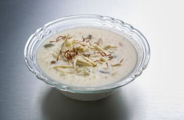 kheer or rice pudding is an Indian dessert in a bowl with dry fruits toppings