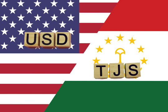 USA and Tajikistan currencies codes on national flags background