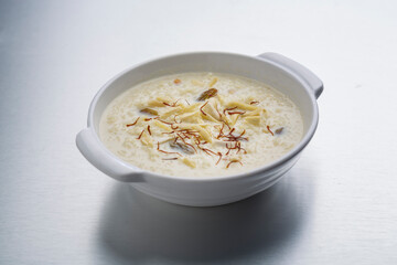 kheer or rice pudding is an Indian dessert in a bowl with dry fruits toppings