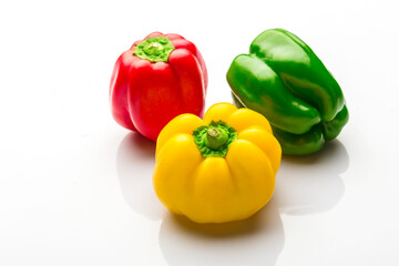 colorful bell peppers isolated on white background
