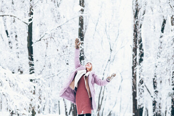 Young woman in the winter with knitted hat and scarf