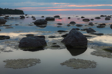 Beautiful rocky sea shore at sunset.