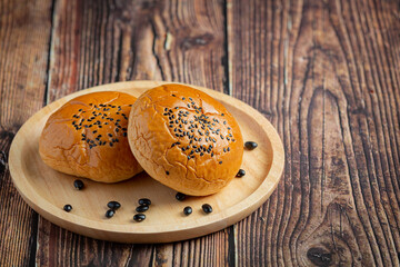 baked black bean paste buns put on dark floor