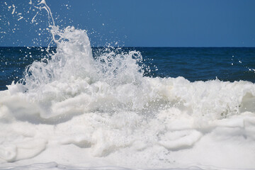 Sea waves break on the shore