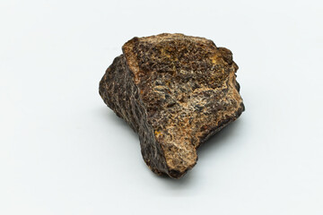 Chondrite Meteorite isolated on white background. © Claudio Caridi