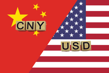 China and USA currencies codes on national flags background