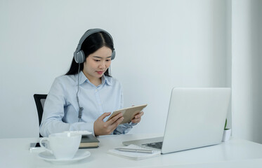 Young Asian teachers are teaching fun online from their home office, social distancing teaching concept during COVID virus diseases
