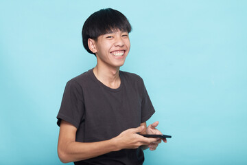 young man use smartphone on blue