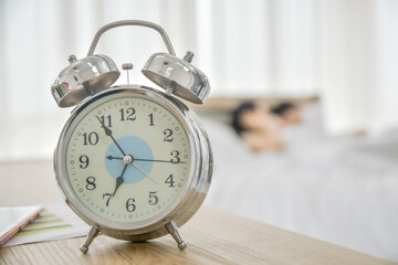 Clock time wake up on table in bedroom