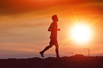 Fototapeta na wymiar Man running at sunset concept sport healthy lifestyle