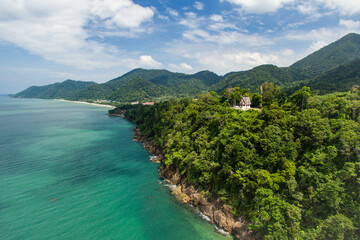 Aerial view of tropical coastline on Koh Chang, Thailand with temple, mountains,jungle and ocean