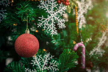 Close up of Colorful balls on Green Christmas tree background Decoration During Christmas and New Year.