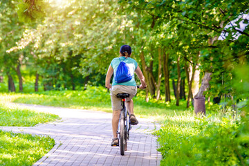 Fototapeta premium Cyclist ride on the bike path in the city Park