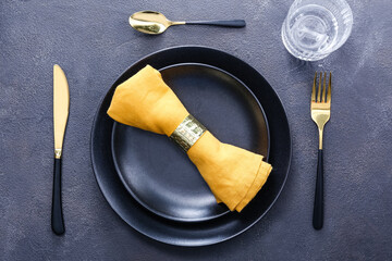 Beautiful table setting on dark background