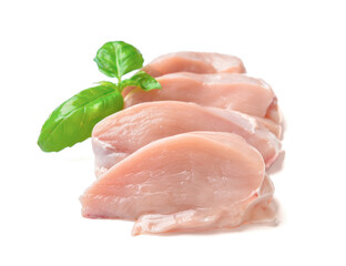 Raw cut chicken fillet with basil on white background