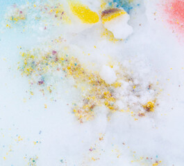 Yellow and purple paint on the snow in winter.