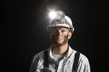 Fototapeta premium Miner man on dark background
