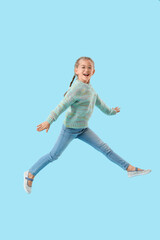 Obraz premium Jumping little girl on color background