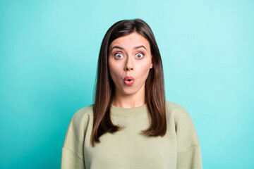 Fototapeta premium Photo portrait of impressed woman isolated on vivid teal colored background