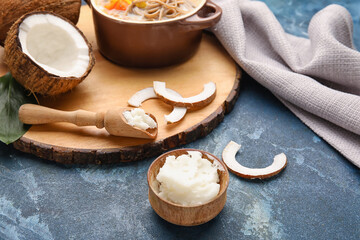 Composition with tasty coconut oil for cooking on color background