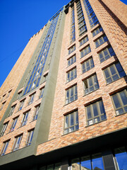 multi-storey building finished with marble bricks.