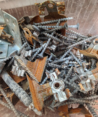 different and old construction fasteners and small parts